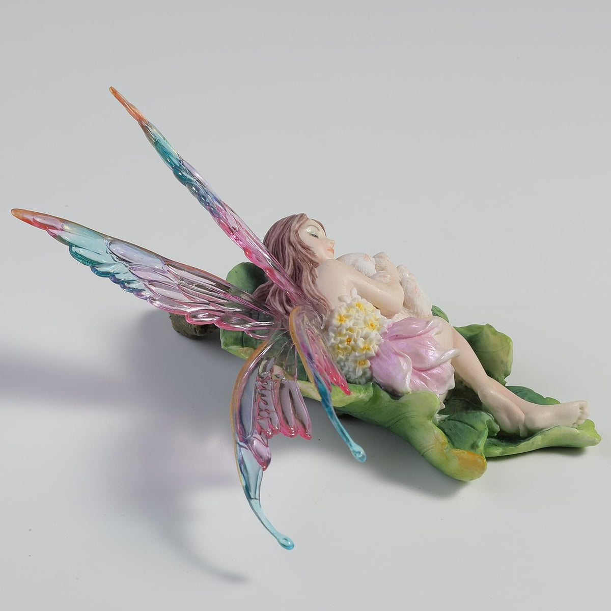 Stellate Fairy Cuddling a Bunny Figurine