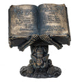 Skeleton holding Spell Book