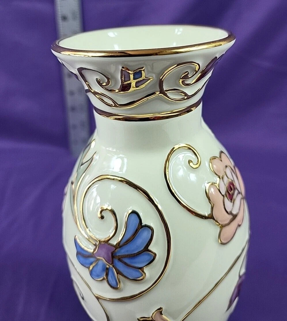 Close-up of Lenox Gilded Garden vase showing raised blue cornflower, pink rose, and gold scrollwork detail
